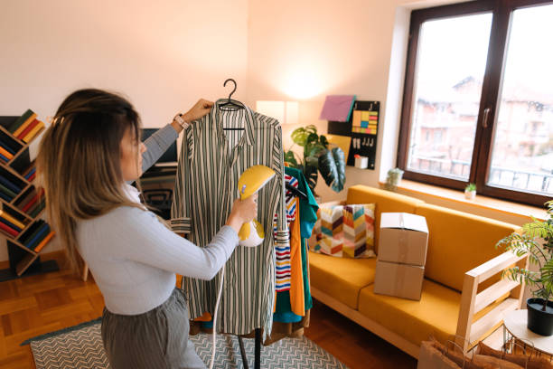 istock Woman ironing clothes at home 2188212333