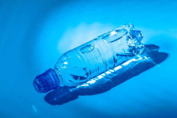 istock Water bottle close up on dark blue background 2188212855