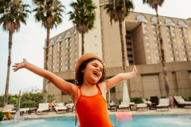 istock Dancing child enjoying vacation at luxury hotel 2188214478