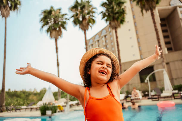 Dancing child enjoying vacation at luxury hotel