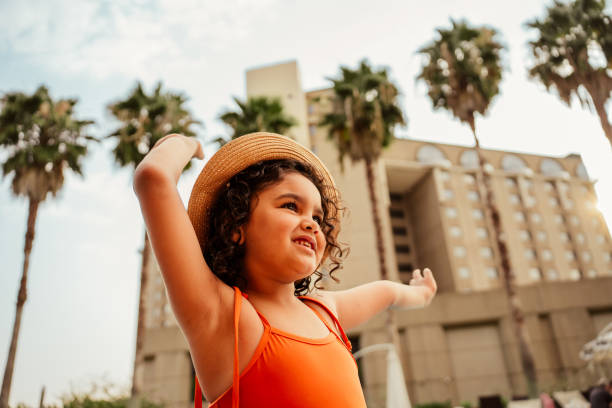 istock Dancing child enjoying vacation at luxury hotel 2188214483