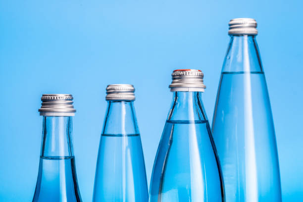 istock Glass water bottles on a light blue background 2188214550