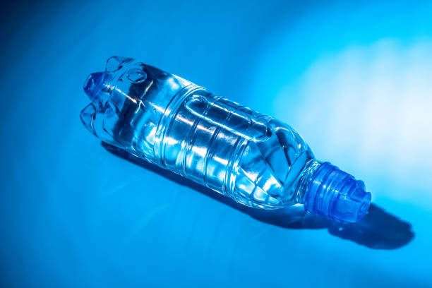 istock Water bottle close up on dark blue background 2188218619