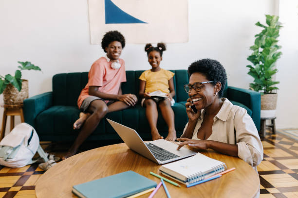 istock Remote work and parenting: Working mom speaking on the phone at home 2188220166