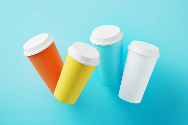 Colorful mockup drink cups on blue background. Horizontal composition with copy space.