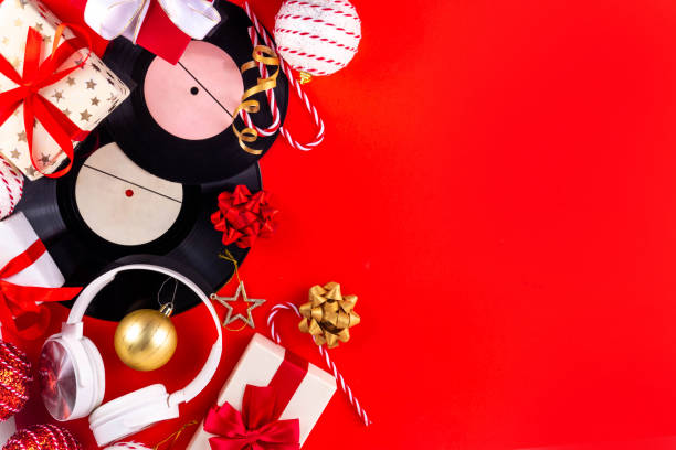 istock Retro vinyl record with Christmas decorations and gift boxes 2188220599