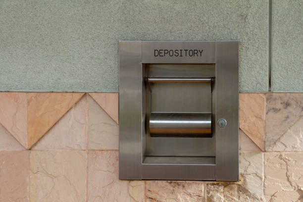istock Bank night depository box attached to a exterior wall 2188221316