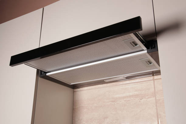 istock Modern Range Hood. Cooking Hood. Kitchen with Modern interior light beige color, Household Appliances. Cooking food at Home 2188221836
