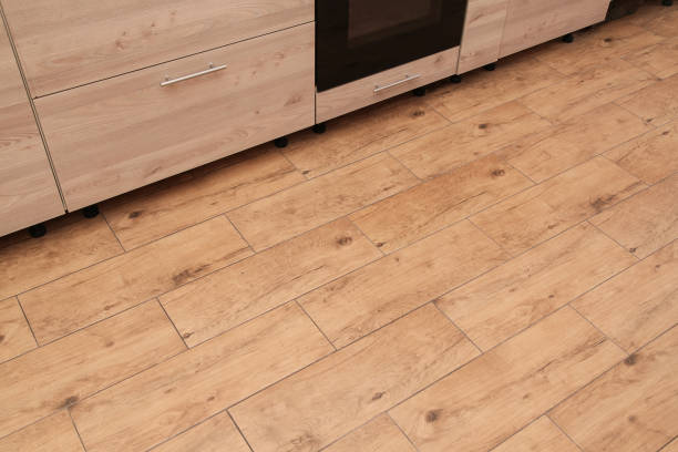 istock Empty place for Carpet, Mat or text. Top view. Ceramic Wood Floor Tiles on Kitchen, Walnut Ceramic Floor. Beige Furniture at Kitchen. 2188221862