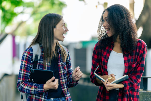istock educational campus University students holding laptops talk or talk about exams, books, friends or outdoor variety. 2188226671
