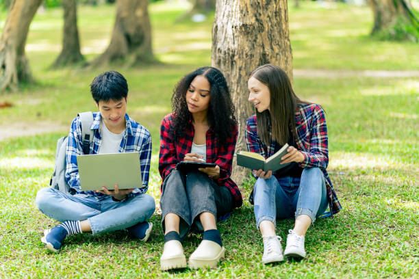 istock educational campus University students holding laptops talk or talk about exams, books, friends or outdoor variety. 2188226700