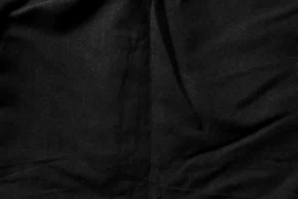 istock Black fabric with subtle folds and a soft dusty matte texture 2188226759