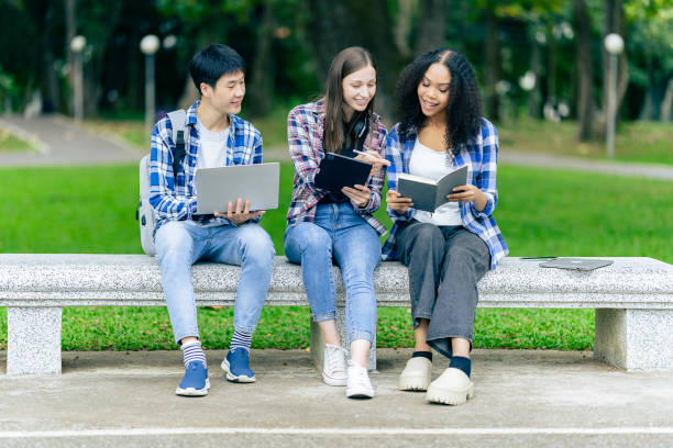 istock educational campus University students holding laptops talk or talk about exams, books, friends or outdoor variety. 2188226769