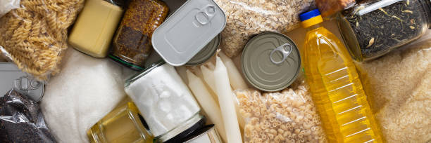 istock Canned goods, cereals, and pasta stored for quarantine and isolation, ensuring long-term survival and food security at home, survival during military operations, the concept of stay at home, banner 2188226921