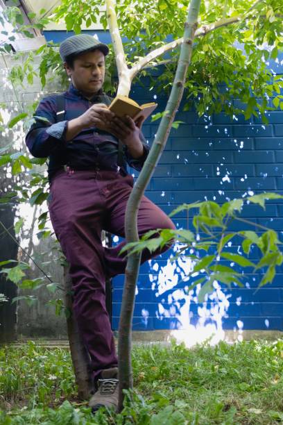 istock a man in the garden reads a book 2188230264