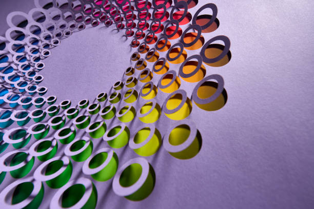 istock Colorful Circular Paper Artwork with Layered Cutouts Forming Gradient Rings on Textured Purple Background 2188230697