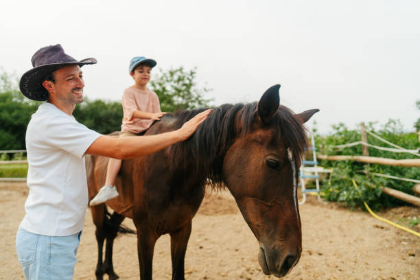 istock Daddy and me at the horse ranch 2188235651