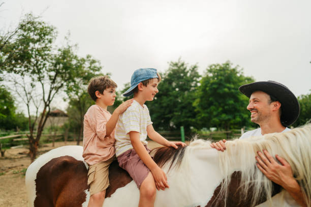 istock With daddy at the horse ranch 2188235653