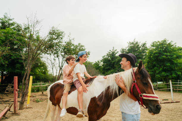 istock With daddy at the horse ranch 2188235704