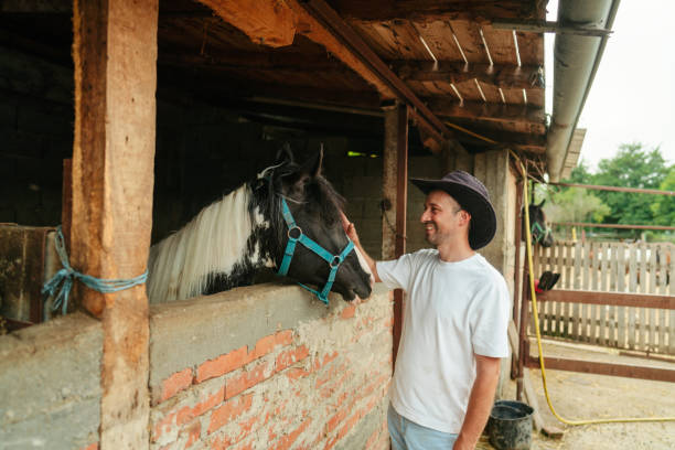 Photo of a mid adult man at the horse ranch