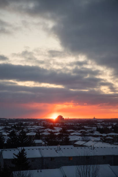 Sunrise over the roofs in winter. Canada.