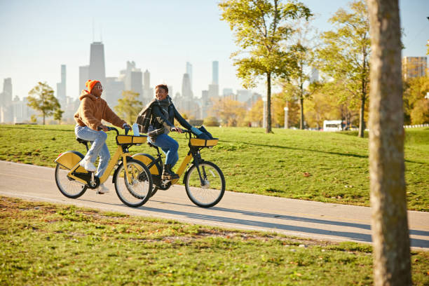istock Environmentally aware women exercising on rental bicycles 2188235863