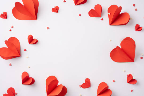 istock A collection of red paper hearts arranged on a white backdrop, symbolizing love and affection. Perfect for Valentine's Day themes, celebrations, and romantic expressions 2188236027