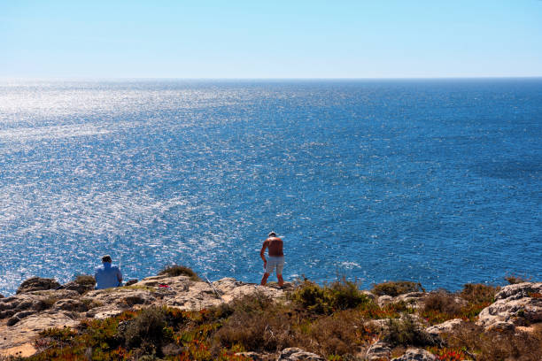 a fisherman on the sea near the fortress 13 September 2024 Sagres Portugal