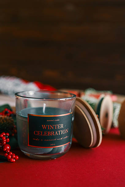 istock A festive glass candle labeled 