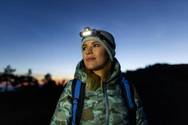 istock Woman hiking at night 2188244282