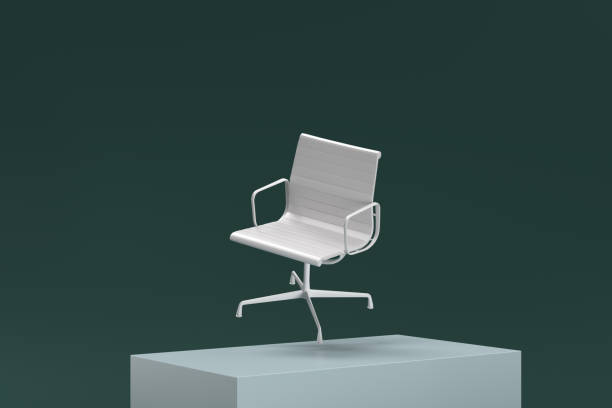 istock A white chair is sitting on a green surface 2188245366