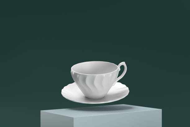 istock A white cup and saucer are suspended in midair 2188245968