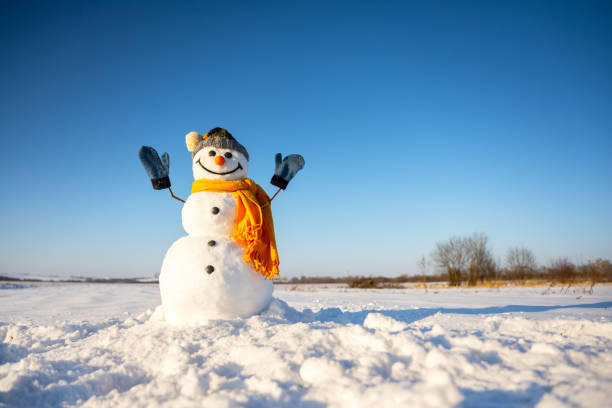 istock Smiley snowman in knitted hat 2188248659