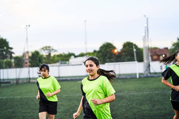 istock Girls running and exercising during training on soccer field 2188248978