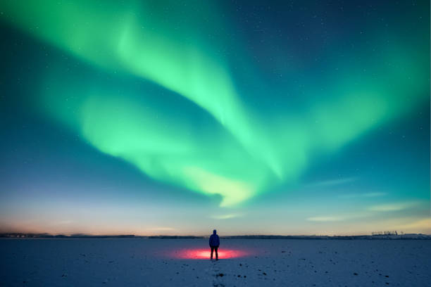 istock Alone person and Aurora Borealis 2188250339