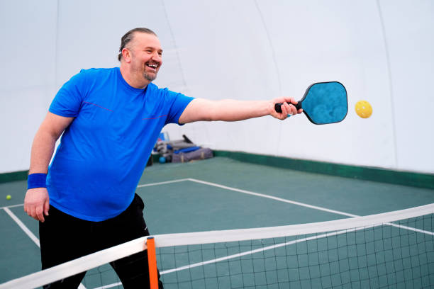 istock Mature men Playing Pickleball indoor 2188252173