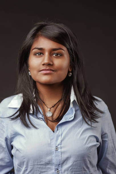 istock Young indian woman looking at camera with serious expression 2188253035