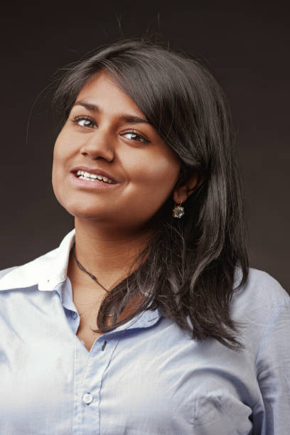 istock Young indian woman smiling and looking at camera 2188253606
