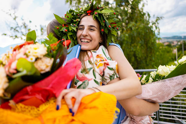 istock Sisters sharing love and smiles on graduation day 2188254856