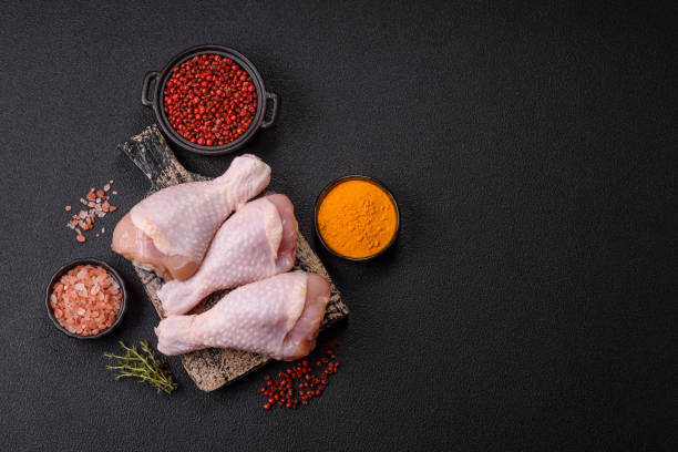 istock Raw chicken legs with salt, spices and herbs 2188255894