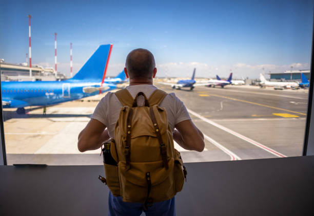 istock Traveler enjoying view on airport runway 2188256047