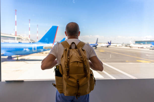 istock Looking through window airport runway from waiting area 2188256301