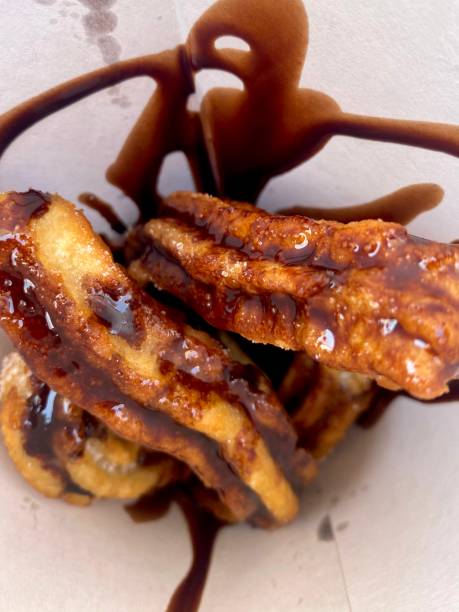 istock Close-Up of Churros with Chocolate Sauce 2188256304