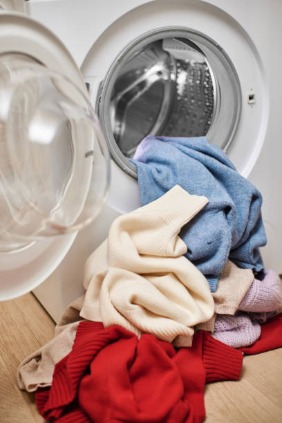 istock laundry inside washing machine with open door. Close up. 2188256625