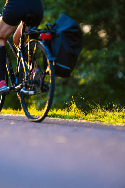 istock Bicyclist on the way to work in morning light.. 2188264810