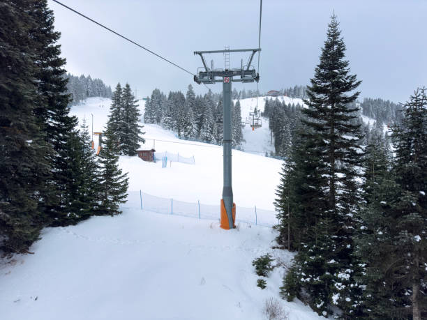 istock Snowy mountain and ski lift 2188267223