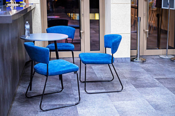 istock cafe with round tables and blue chairs 2188267803