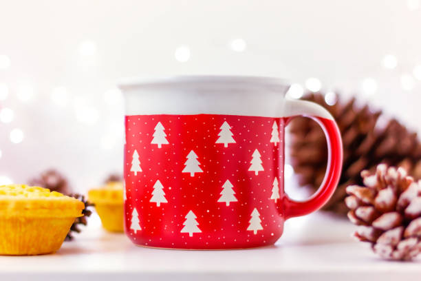istock close up red cup with Christmas trees and cakes with snowflake and pine cone 2188270791