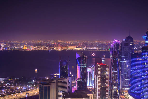 Doha, Qatar - May 26, 2010: Doha's Corniche in the West Bay area. The Corniche is a popular exercise location known for fantastic promenades, water sports, traditional dhow races and more