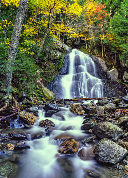 Waterfall in autumn in Vermond, small creek or river